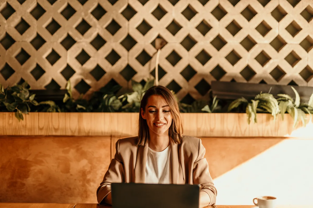 A klaru accountant reviewing client records on a laptop